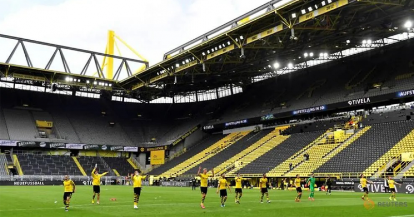 Dortmund explode into action as Bundesliga restarts with no fans