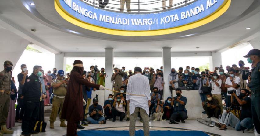 Two gay men publicly lashed 77 times for having sex in Indonesia's Aceh