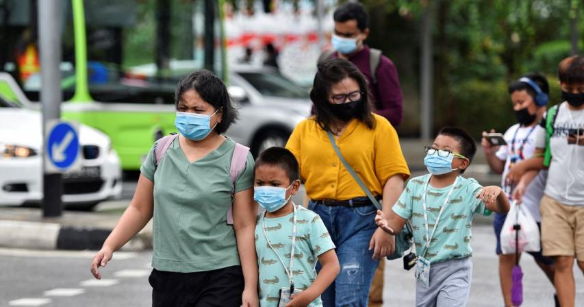 Singapore warns children susceptible to virus variants, shuts schools 