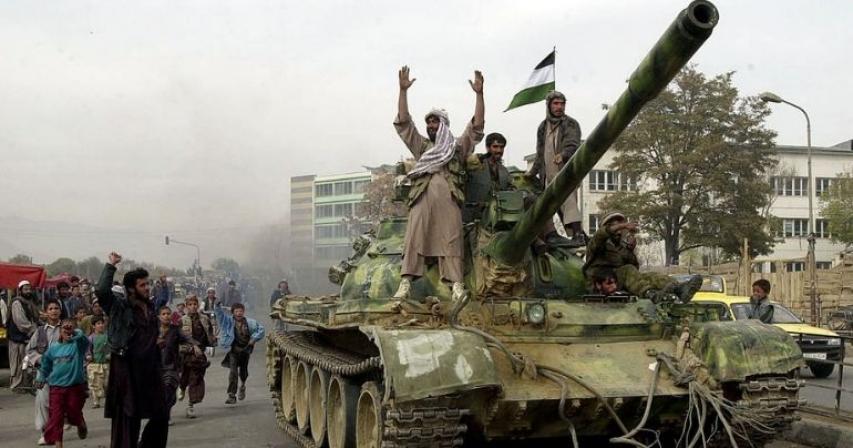 Taliban battle their way into western Afghan city