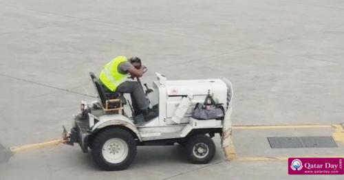Airport worker filmed sleeping on baggage truck on runway
