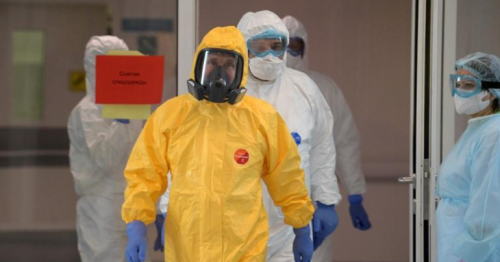 Putin dons hazmat suit as Moscow says coronavirus outbreak is worse than it looks