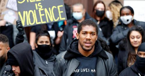 World boxing champion Joshua attends march, says racism is a pandemic