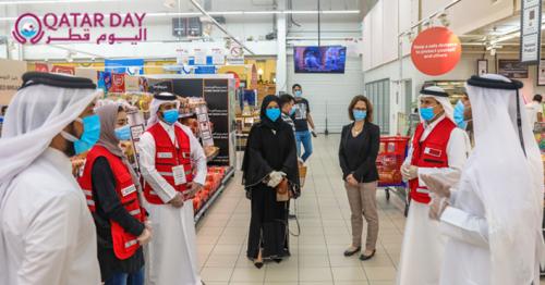 Qatar Red Crescent Society officials during visits to volunteers at shopping centers