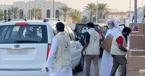 Qatar Charity distributes food parcels to Asian expatriate families