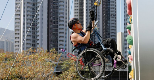 In wheelchair, paraplegic Lai Chi-wai climbs up skyscraper in Hong Kong