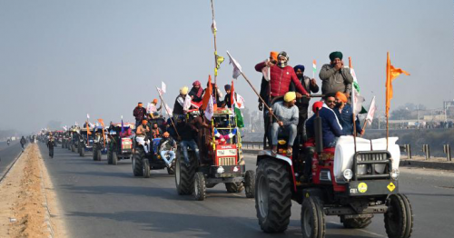 Indian farmers ramp up their protest by riding tractors into the capital