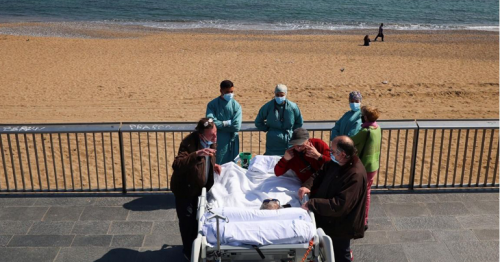 After 114 days in ICU, Catalan COVID-19 patient soaks up seaside sunshine