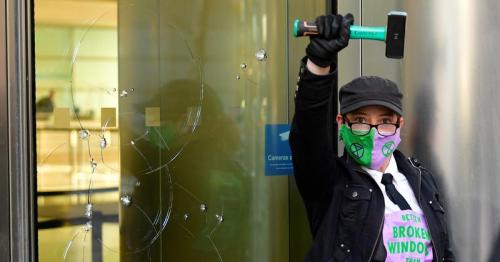 Climate change protesters break windows at Barclays London HQ 