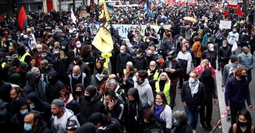 Protesters march in Paris and other French cities on May Day 