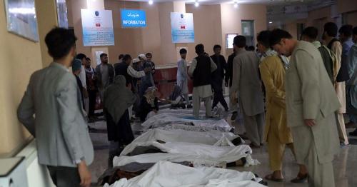 Afghan school blast toll rises to 58, families bury victims
